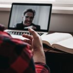 A student speaks with a teacher via videoconference