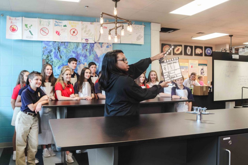 a class gathers to film a video