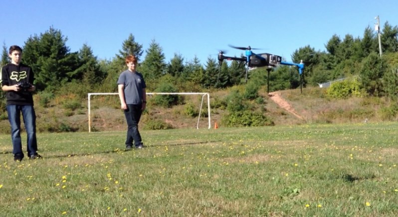 students fly drones