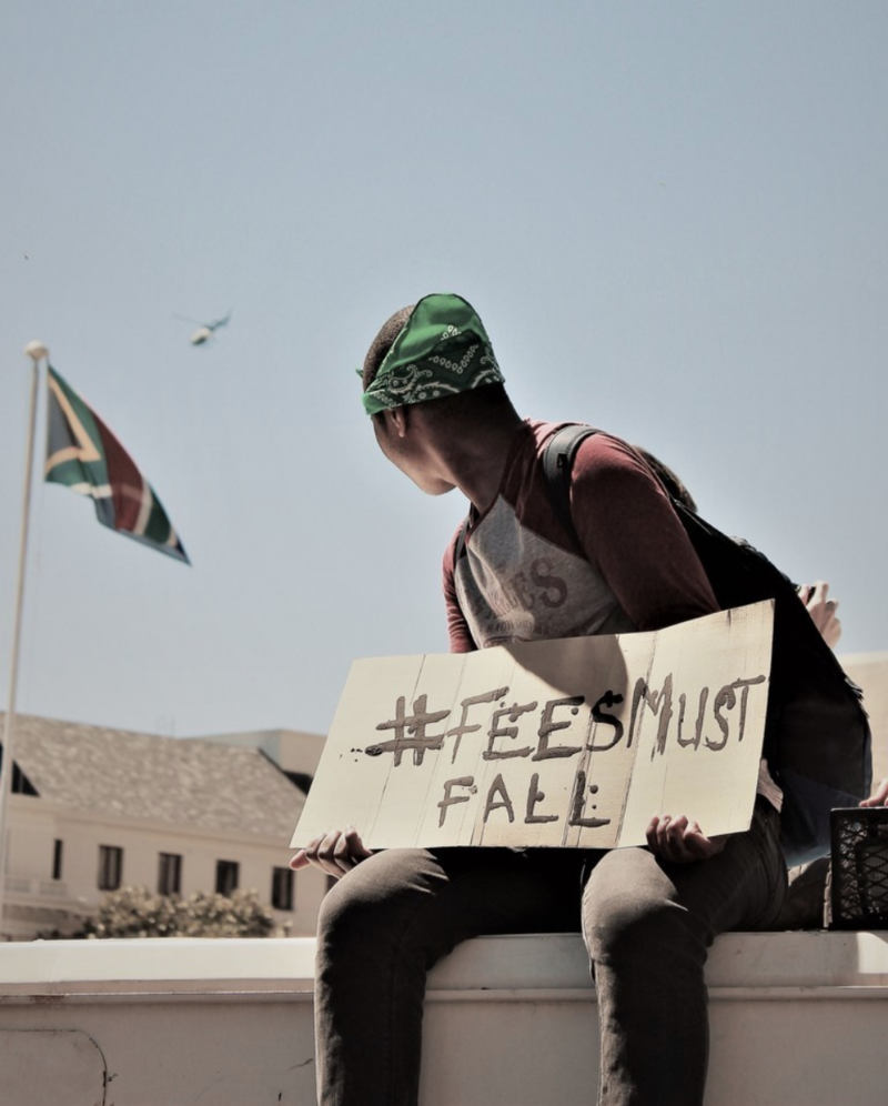 A protester demonstrates during the #FeesMustFall protest.